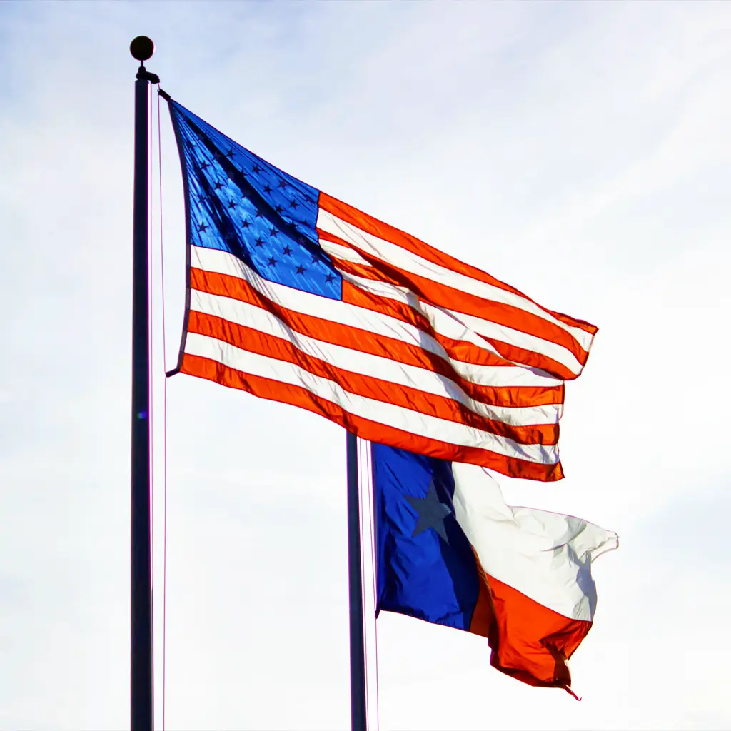A United States flag and a Texas flag